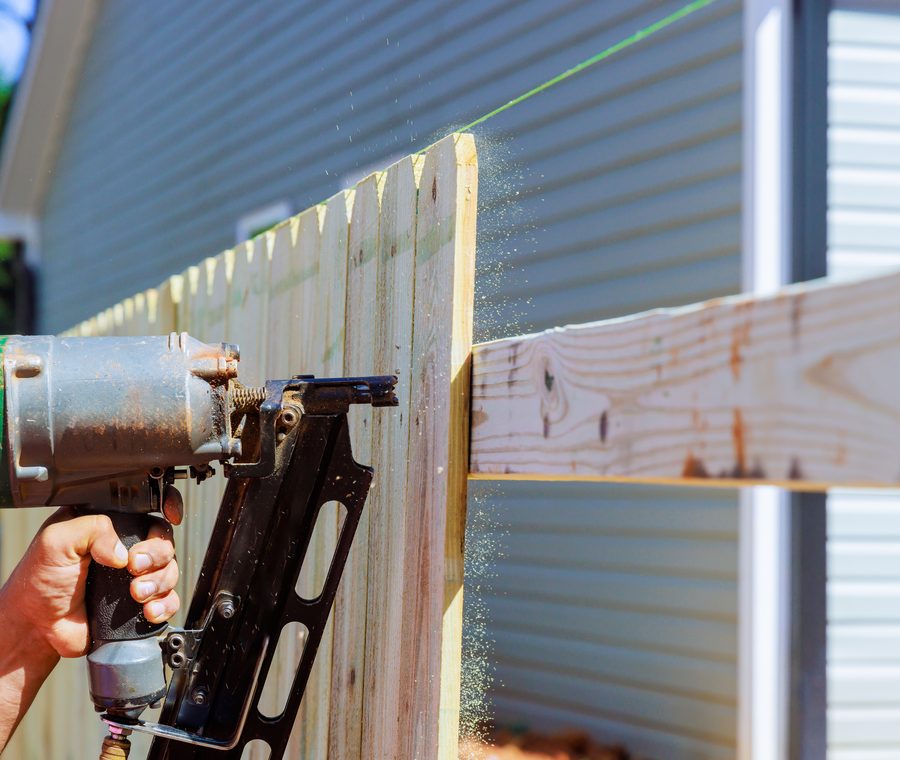 Building a wood privacy fence with a nail gun