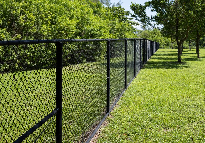 Black chain-link fence installation